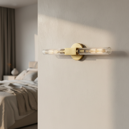Ravello black linear wall sconce glowing above modern living room sofa