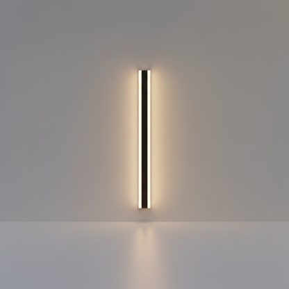 Studio shot of Yara black aluminum wall lamp with gold accents on clean white background