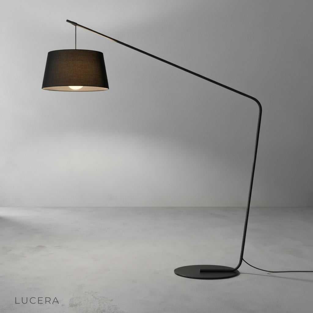 studio shot of Ignatian floor lamp with wide circular shade and sleek curved stem