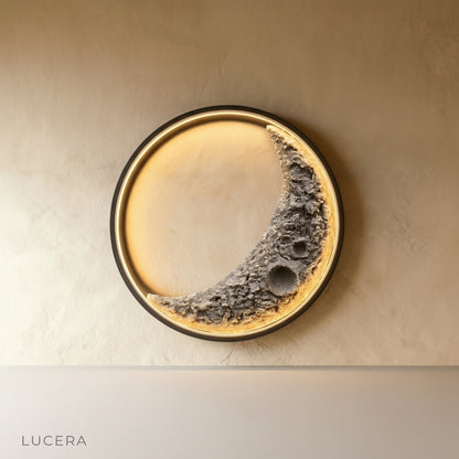 Haldor Moon Wall Lamp glowing in modern living room with matte black iron crescent moon
