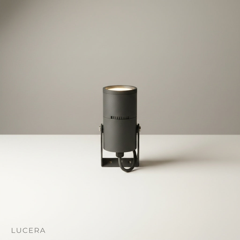 studio shot of cylindrical aluminum outdoor spotlight on clean white background