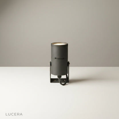 studio shot of cylindrical aluminum outdoor spotlight on clean white background