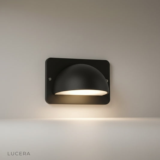 studio shot of Rosalie outdoor wall lamp with dome aluminum shade and PC diffuser