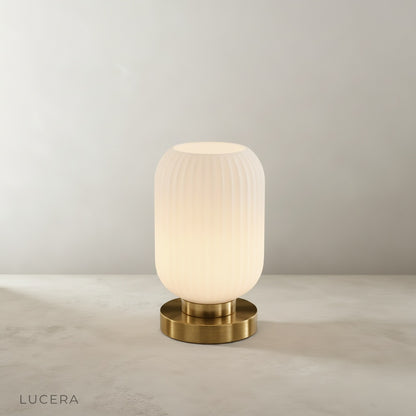 studio shot of divine table lamp front view on neutral beige background