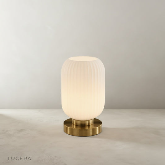 studio shot of divine table lamp front view on neutral beige background