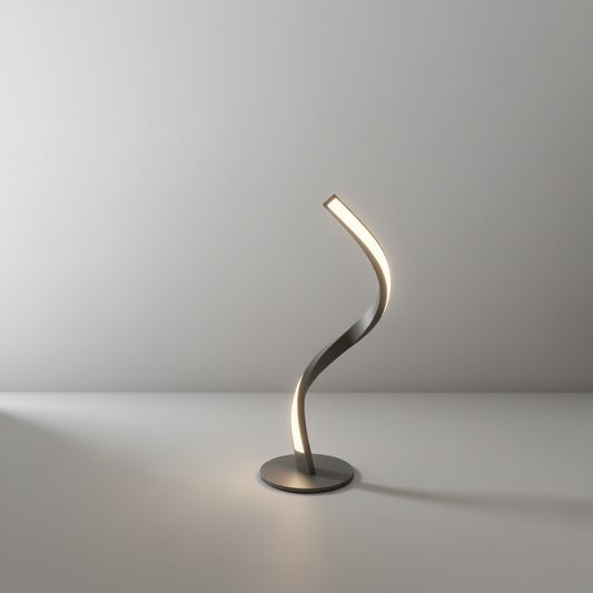 studio shot of glossy curved metal table lamp with white shade