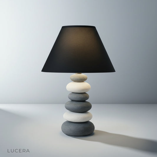 Studio shot of Celestine Table Lamp with ceramic stone base and beige cloth shade