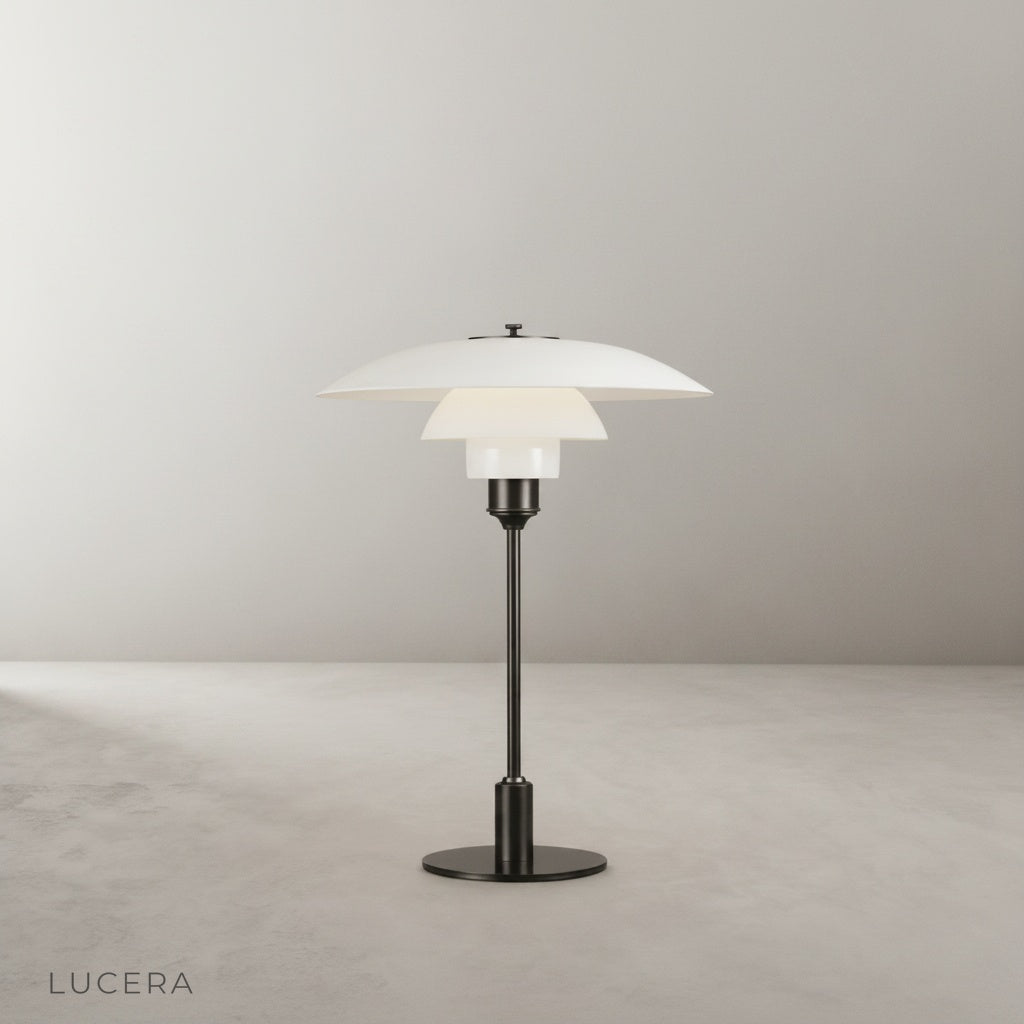 studio shot of baccarat table lamp with green shade and frosted glass diffuser