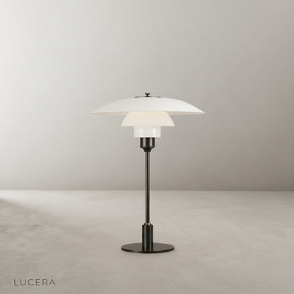 studio shot of baccarat table lamp with green shade and frosted glass diffuser