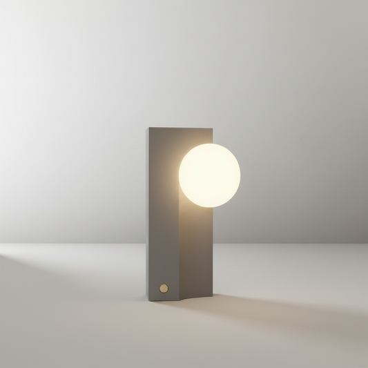 minimalist concrete and frosted glass table lamp on clean white studio background