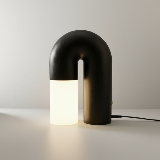 Studio shot of Vigil Table Lamp with curved wood base and frosted acrylic shade