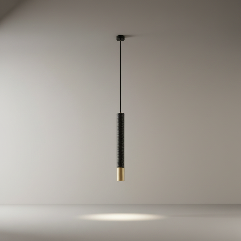 studio shot of a cylindrical aluminum Fascinate pendant light with contrasting gold band