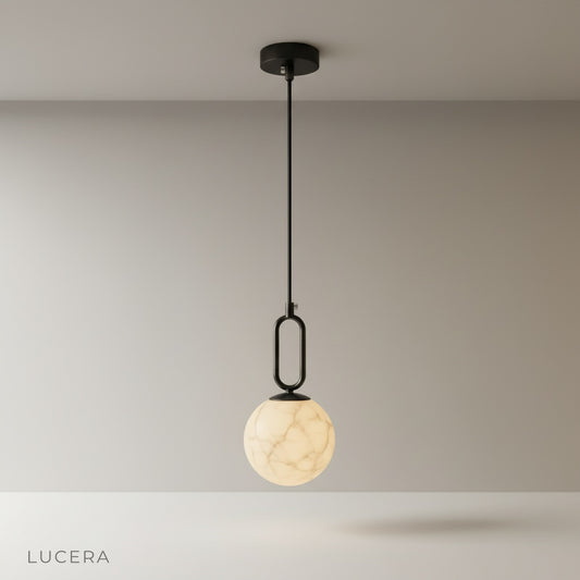 studio shot of teardrop alabaster pendant light on clean background