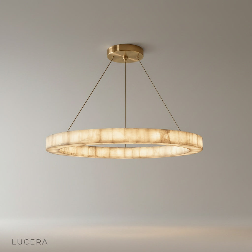 Studio shot of the Bamboo Round Alabaster Chandelier with polished stone halo rings and steel frame