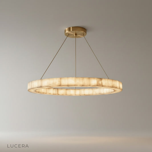 Studio shot of the Bamboo Round Alabaster Chandelier with polished stone halo rings and steel frame