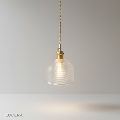 studio shot of Harmony Pendant Light brass and glass shade centered on clean white background