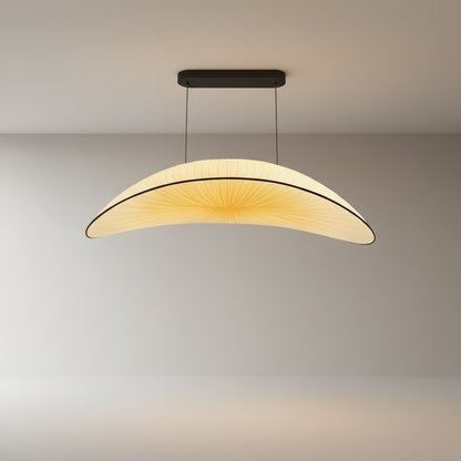 studio shot of Dart Silk Chandelier with hand-dyed silk shade and curved brass frame on white background