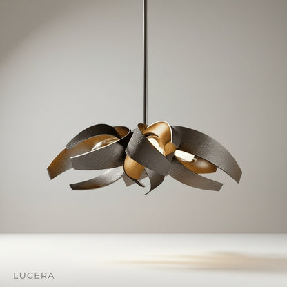 Incanto Chandelier hanging above a modern dining table in a bright open-concept living space