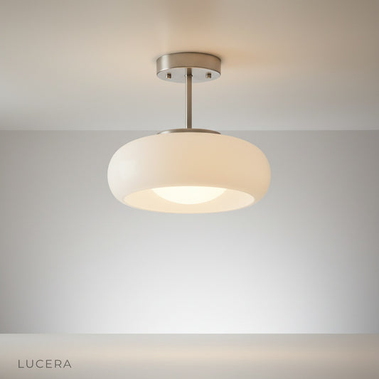 Bishop ceiling light illuminating modern living room with warm ambient glow
