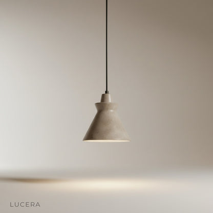 Studio shot of Jazzle pendant light front view showing flared yellow travertine stone and wood top detail