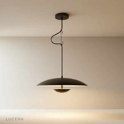 Studio shot of the black dome-shaped Cinder Pendant Light against a clean white background