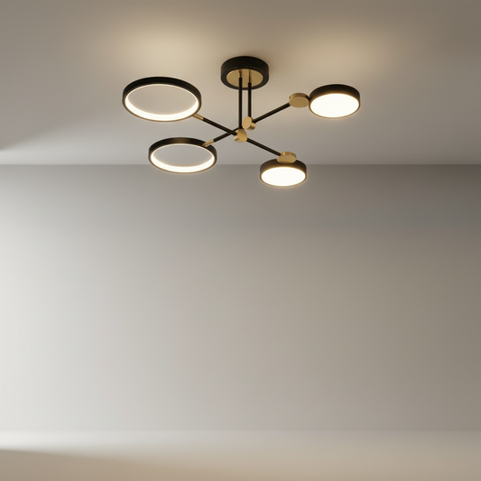 Studio shot of yin-yang ceiling light with circular forms and linear arms in black and gold