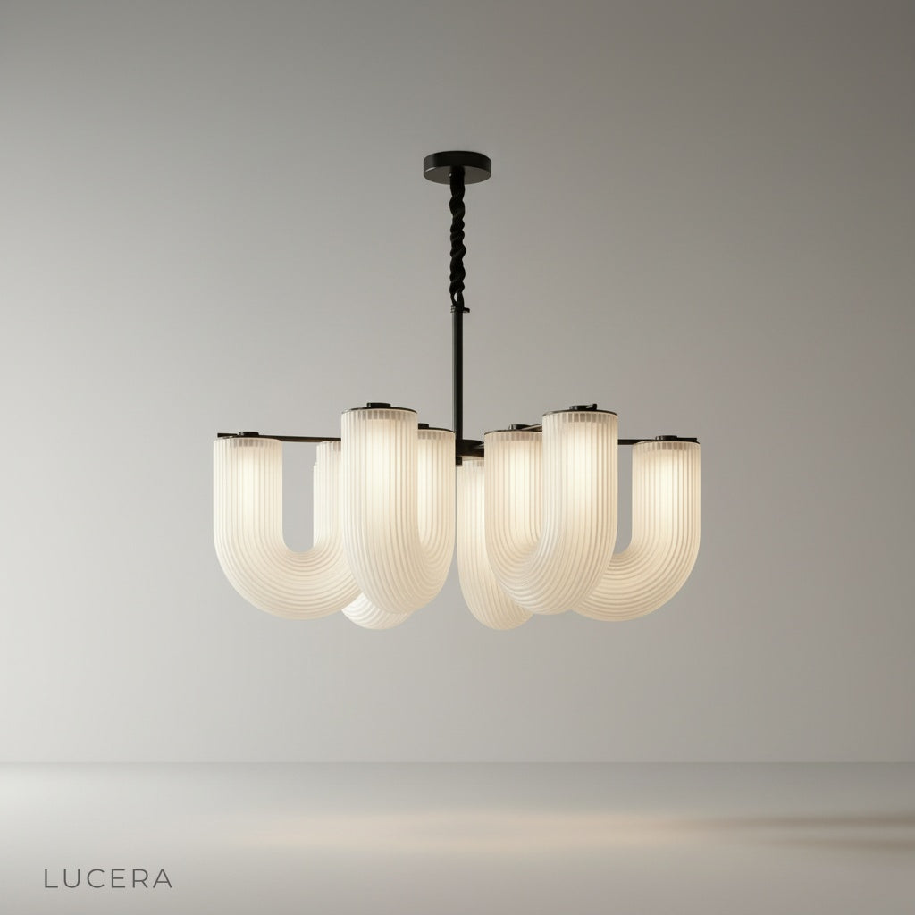 studio shot of Thalassa chandelier in black finish with six clear acrylic heads