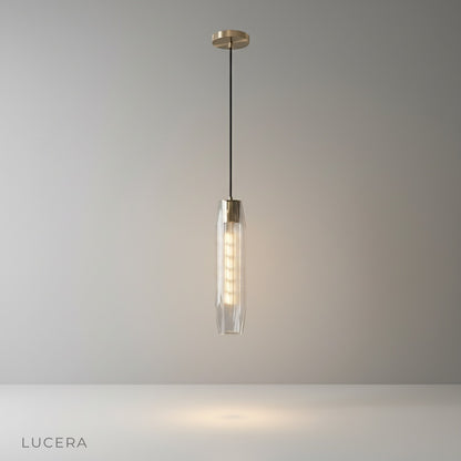 Hester Pendant Light studio shot front view with faceted crystal shade and brass frame