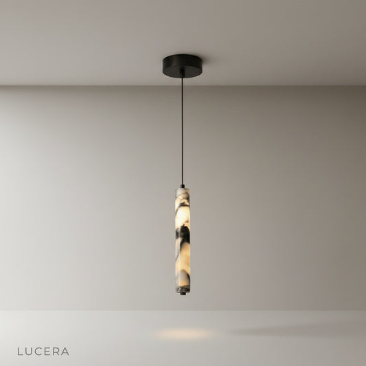 modern marble pendant light glowing warmly above a minimalist dining table in a bright living room
