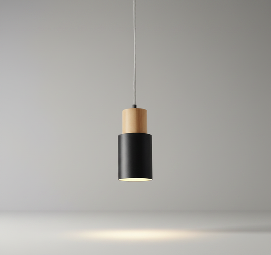 Burning pendant light glowing above a modern dining table in a bright living room