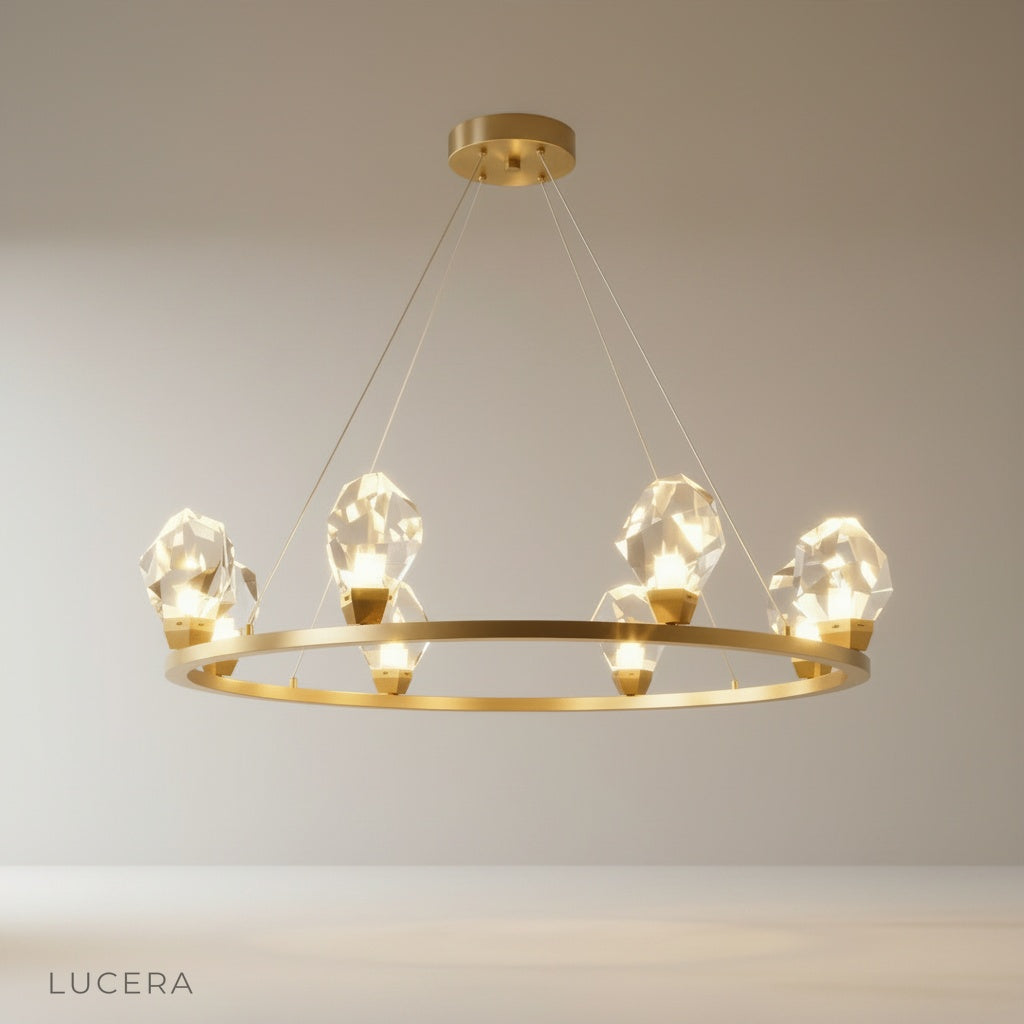 Studio shot of Mesa Round Chandelier with clear glass shades and brushed gold finish