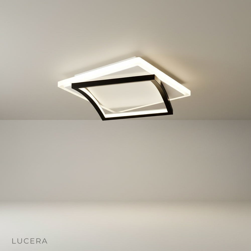 studio shot of broom ceiling light with sleek metal and acrylic finish on white background