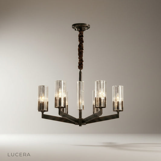 studio shot of Garnish chandelier with cylindrical glass shades and geometric frame