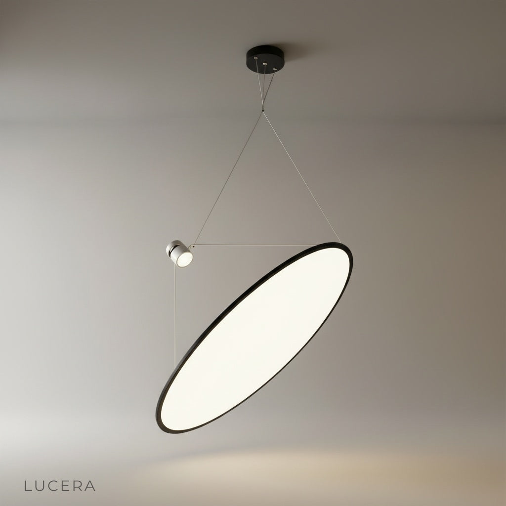 modern black disc pendant light illuminating kitchen island with white panel glow