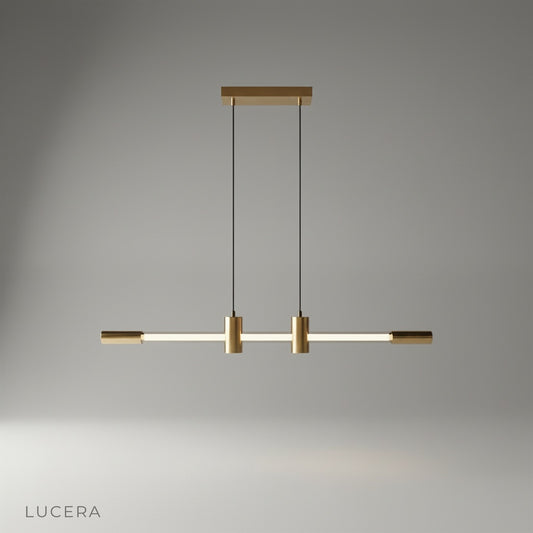 Gideon pendant light with brass accents and glass neon tube on a clean studio background
