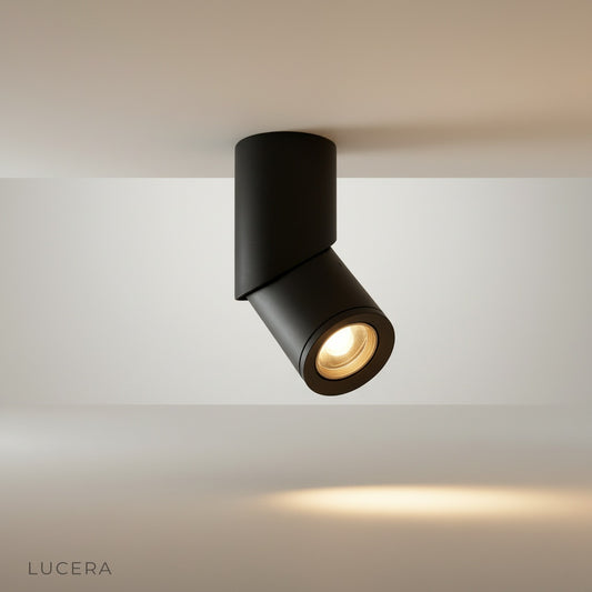 studio shot of round white downlight trim on neutral background