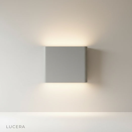 studio shot of matte aluminum rectangular wall lamp front view