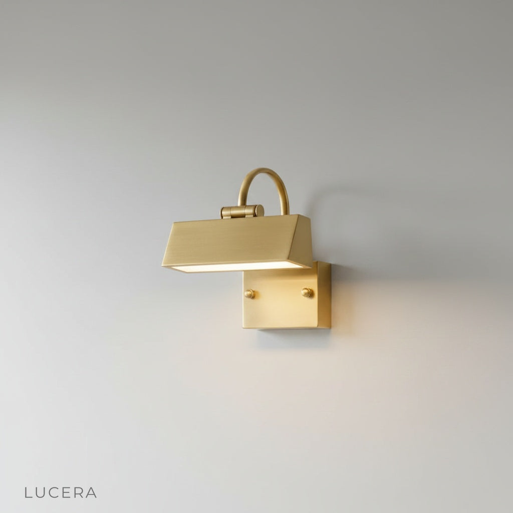Minimalist black metal Quiete wall lamp mounted on a clean white studio wall