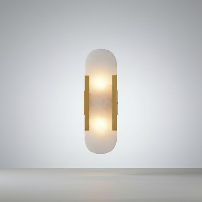 Studio shot of Nettle wall lamp with gold frame and white marble shade on neutral background