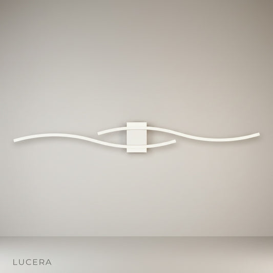 Alessandra Wall Lamp glowing softly in modern living room with minimalist decor