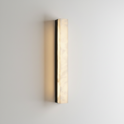Dara wall lamp front view on clean white studio background showing alabaster shade
