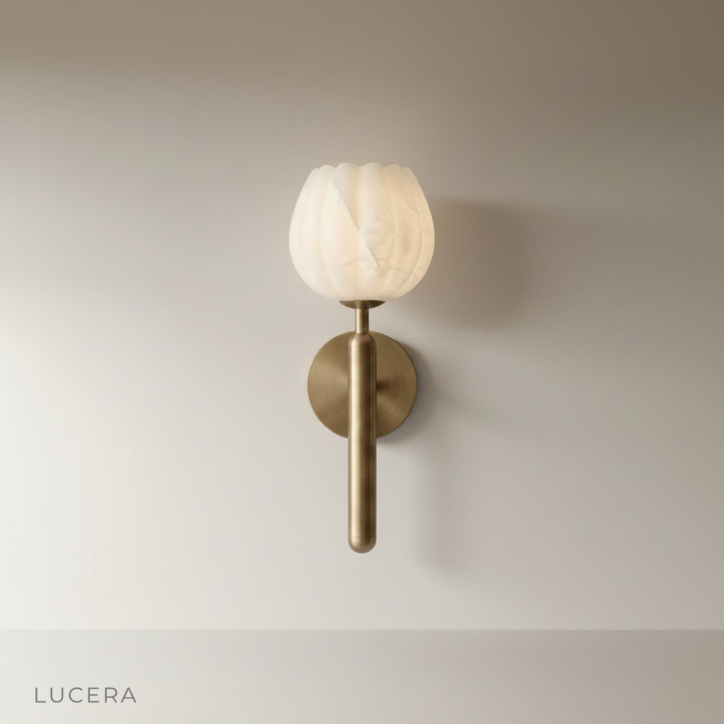 studio shot of the Madeira wall lamp with sculptural alabaster shade and solid copper structure