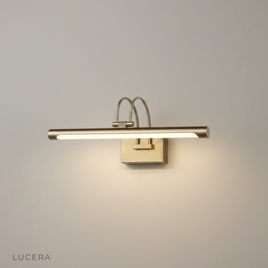 Lucian wall lamp studio shot front view with polished metallic finish