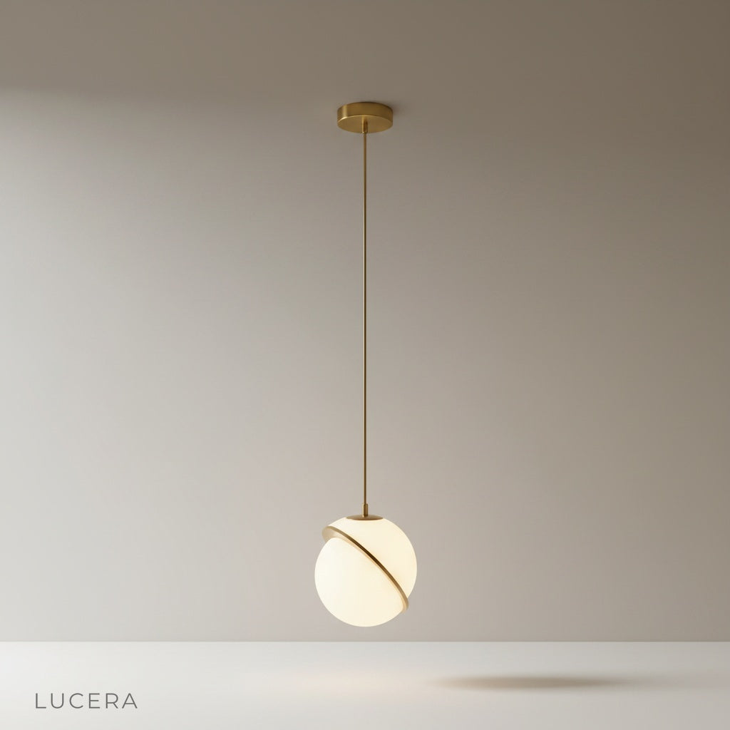 Igneous pendant light studio shot front view with white acrylic sphere and brass iron