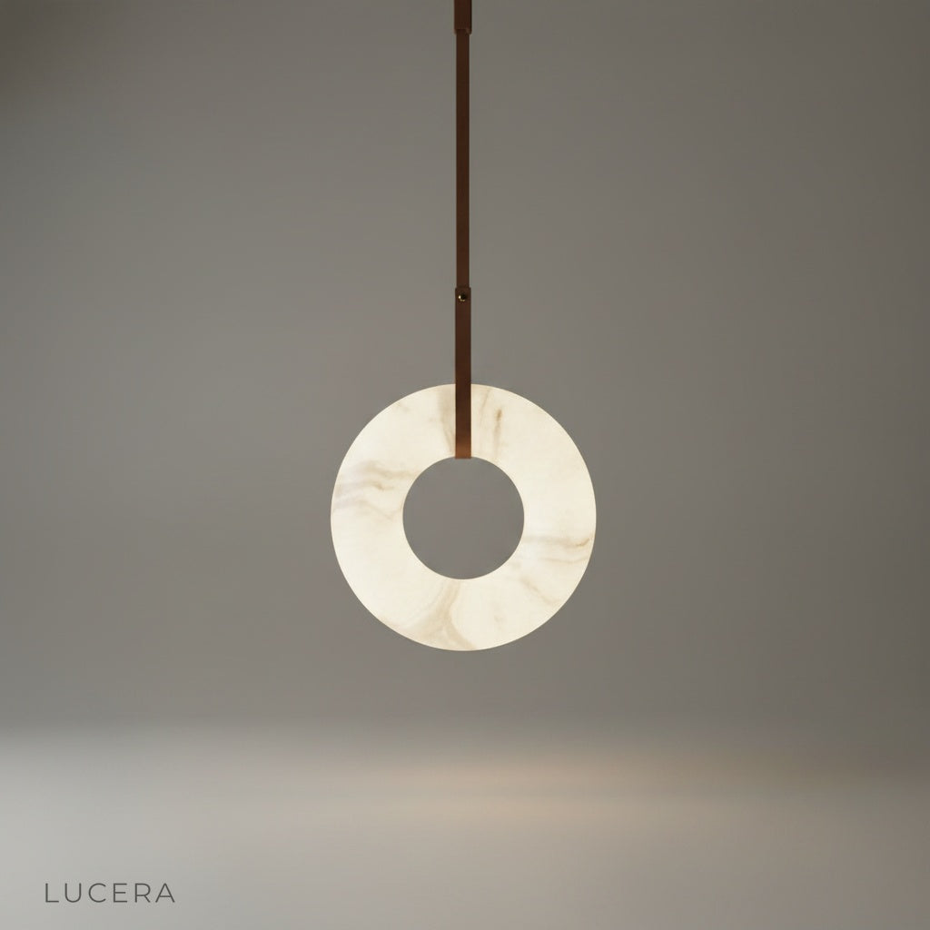 studio shot of Helix alabaster pendant light with leather straps on clean white background