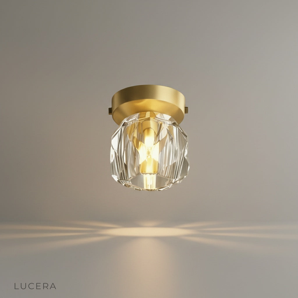 studio shot of utopia ceiling light with gold plate and crystal lampshade