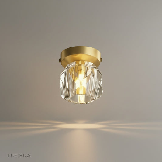 studio shot of utopia ceiling light with gold plate and crystal lampshade