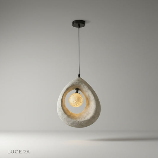 Kelp pendant light casting warm glow in minimalist living room with neutral tones