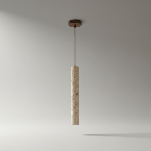 Studio shot of cylindrical yellow travertine pendant light against neutral background