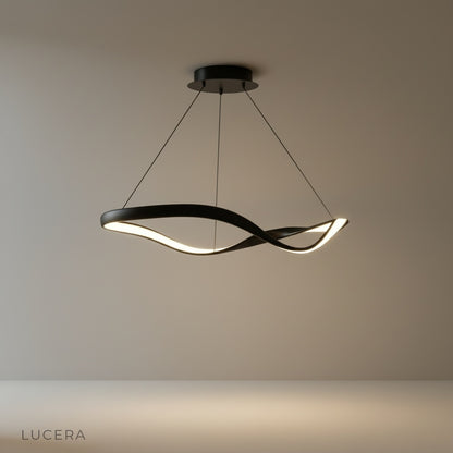 Deacon modern ring chandelier glowing in a contemporary living room with warm ambient light
